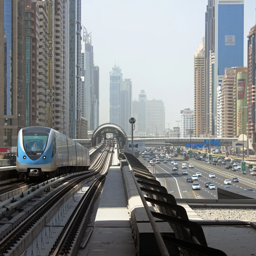 picture showing financial center metro station and buildings also train in financial center dubai area